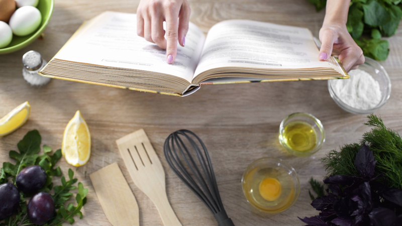 Turn Your Home Into a Restaurant With These Pro Cookbooks | Shutterstock