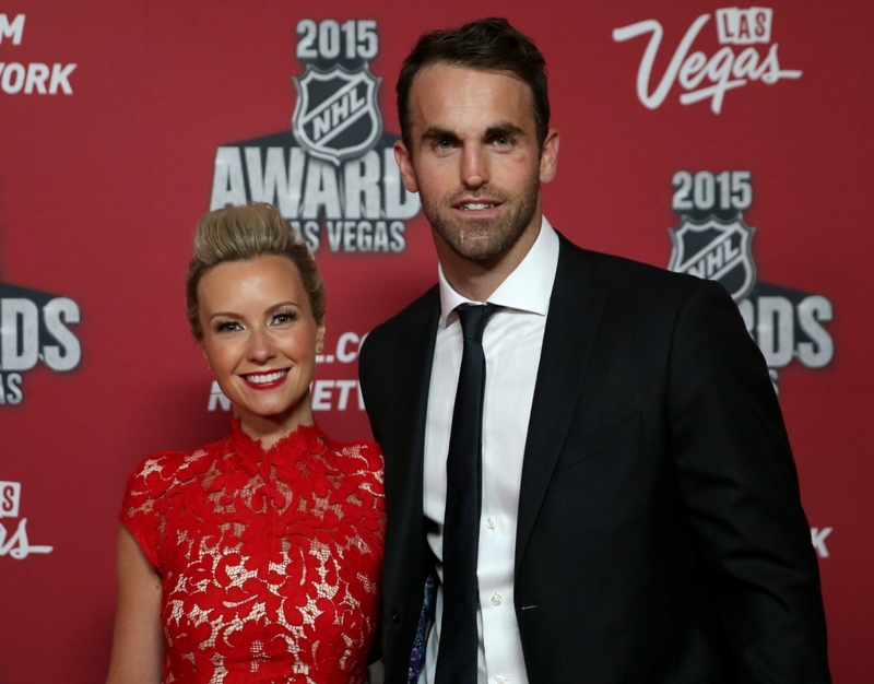 Andrew Ladd & Brandy Johnson | Getty Images Photo by Bruce Bennett