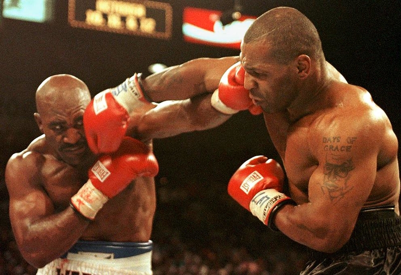 MIKE TYSON AND EVANDER HOLYFIELD | Getty Images Photo by JEFF HAYNES/AFP