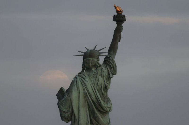 Lady Liberty’s Torch | Getty Images Photo by Gary Hershorn