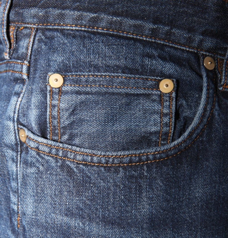 Randomly Placed Buttons on Jeans | Getty Images Photo by Vincenzo Lombardo