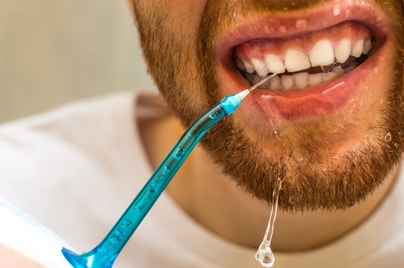 Up Your Waterpick Flossing Game | Alamy Stock Photo