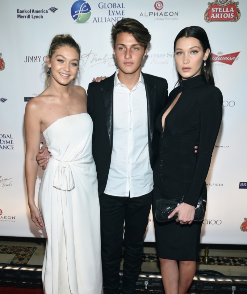 Gigi And Bella Hadid With Their Brother Anwar | Getty Images Photo by Dimitrios Kambouris/Global Lyme Alliance