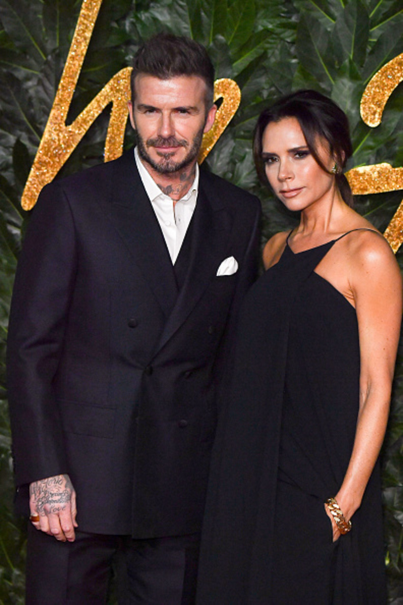 Victoria Adams and David Beckham (Soccer Player) | Getty Images Photo by Stephane Cardinale - Corbis