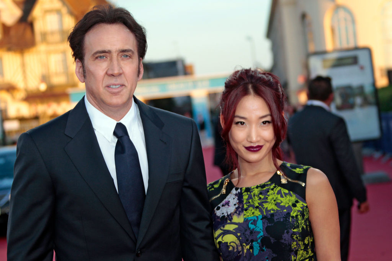 Nicolas Cage and Alice Kim (Waitress) | Getty Images Photo by CHARLY TRIBALLEAU/AFP