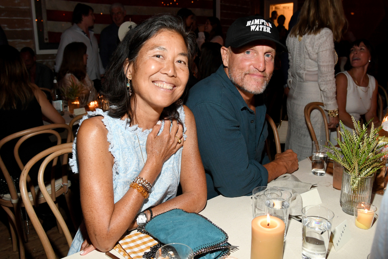 Woody Harrelson and Laura Louie | Getty Images Photo by Kevin Mazur
