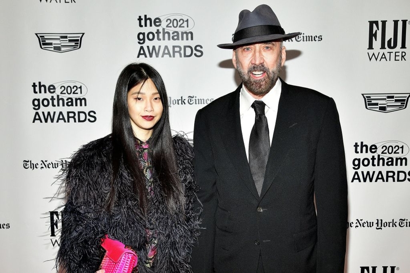 Nicholas Cage and Riko Shibata | Getty Images Photo by Eugene Gologursky/FIJI Water