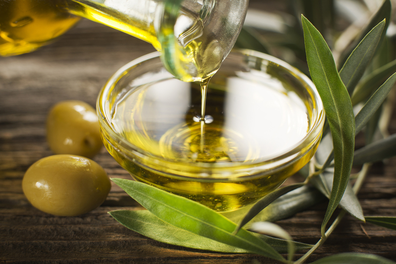 She Drinks Olive Oil | Shutterstock Photo by DUSAN ZIDAR