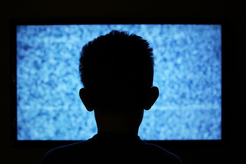 Sitting Too Close to the TV Hurts Your Eyesight | Shutterstock