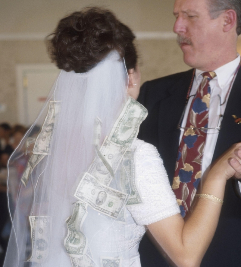 Paying to Dance With the Bride | Alamy Stock Photo