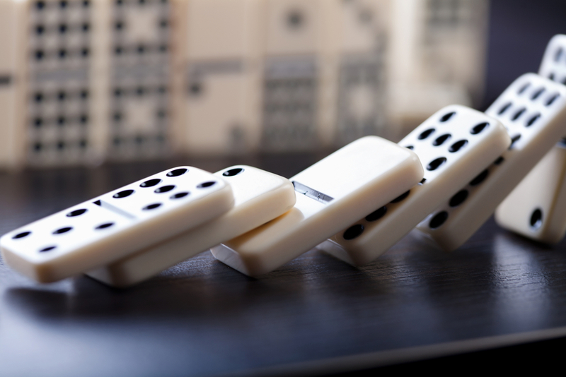 Don't Drop the Domino | Oliver Britton/Shutterstock