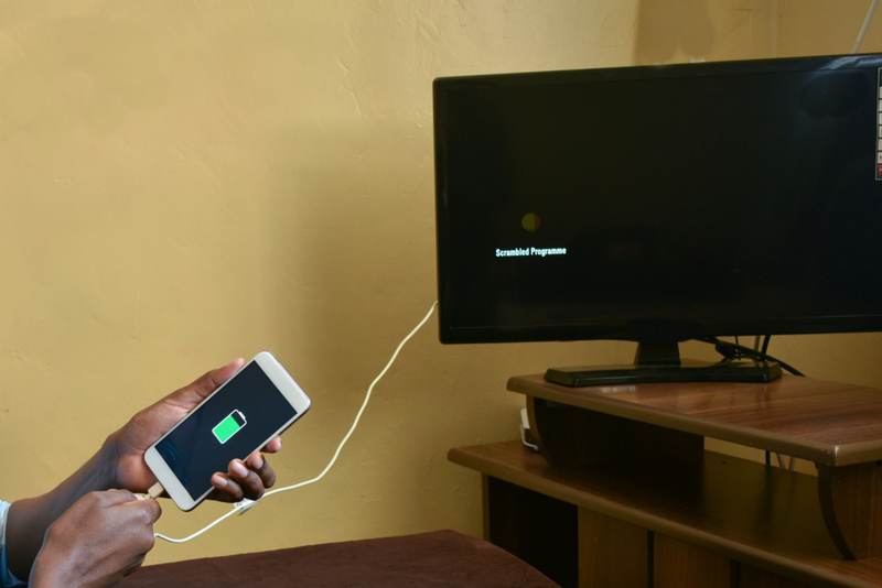 Use a TV to Charge Your Phone | Shutterstock Photo by Kenyan nature