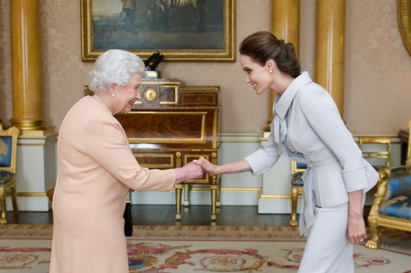 Queen Elizabeth and Angelina Jolie | Alamy Stock Photo by REUTERS/Anthony Devlin/pool 