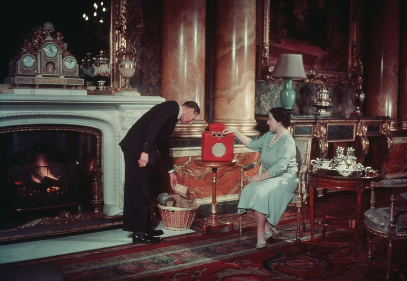King and Queen at the Palace | Getty Images Photo by Hulton-Deutsch Collection/CORBIS