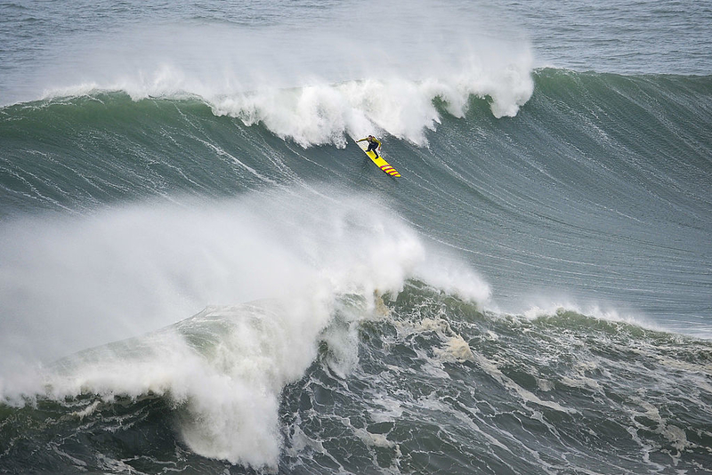 Surfing A 100 Foot Wave | Getty Images Photo by PATRICIA DE MELO MOREIRA/AFP