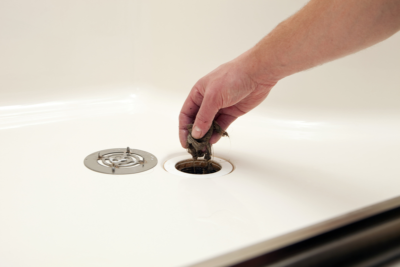 Unblock a Clogged Shower Drain | Getty Images Photo by BanksPhotos