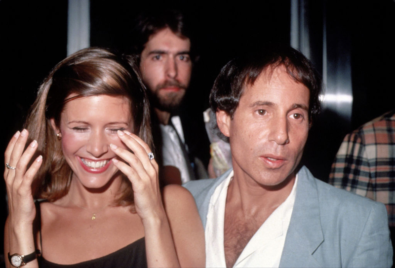 Carrie Fisher and Paul Simon | Getty Images Photo by Robin Platzer/Images Press
