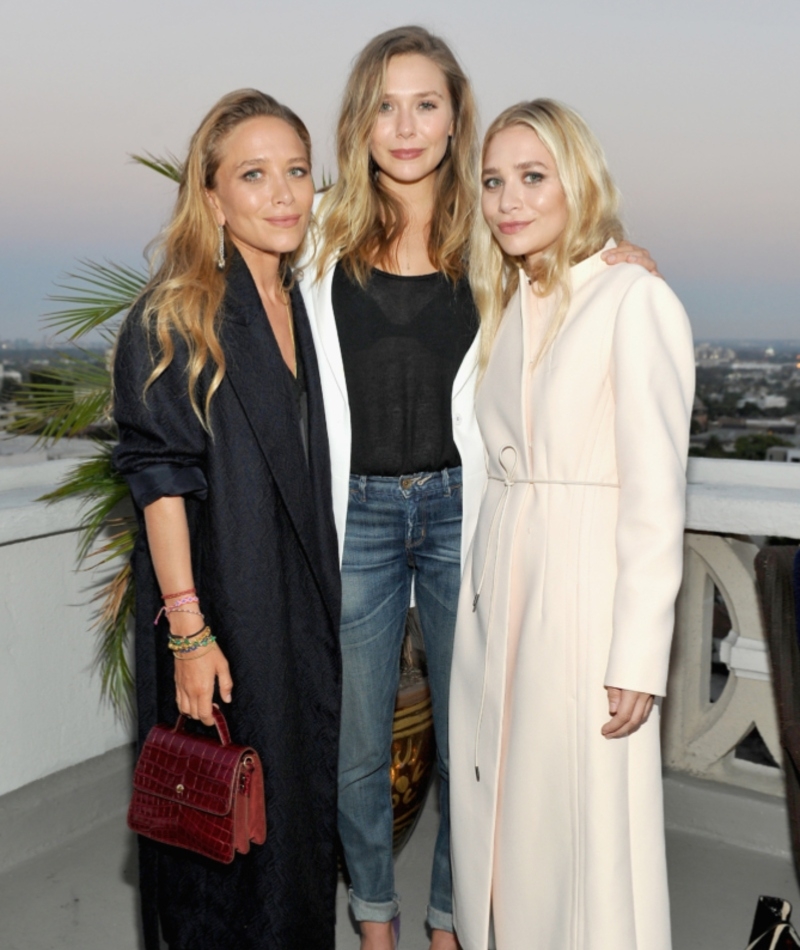 Mary-Kate And Ashley Olsen With Their Younger Sister Elizabeth | Getty Images Photo by Donato Sardella/InStyle