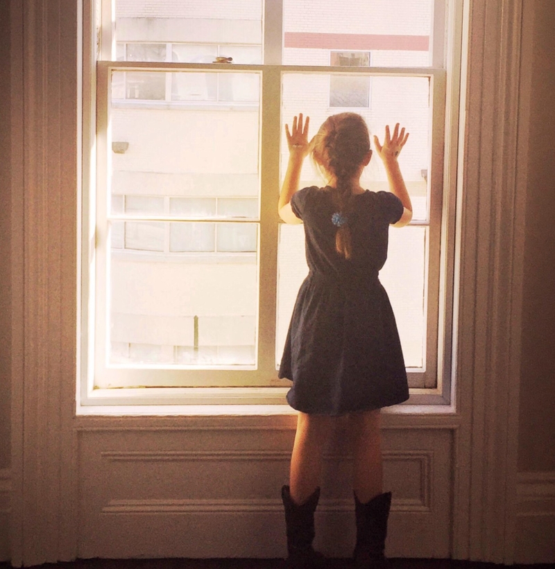 A Mysterious Window Girl | Alamy Stock Photo