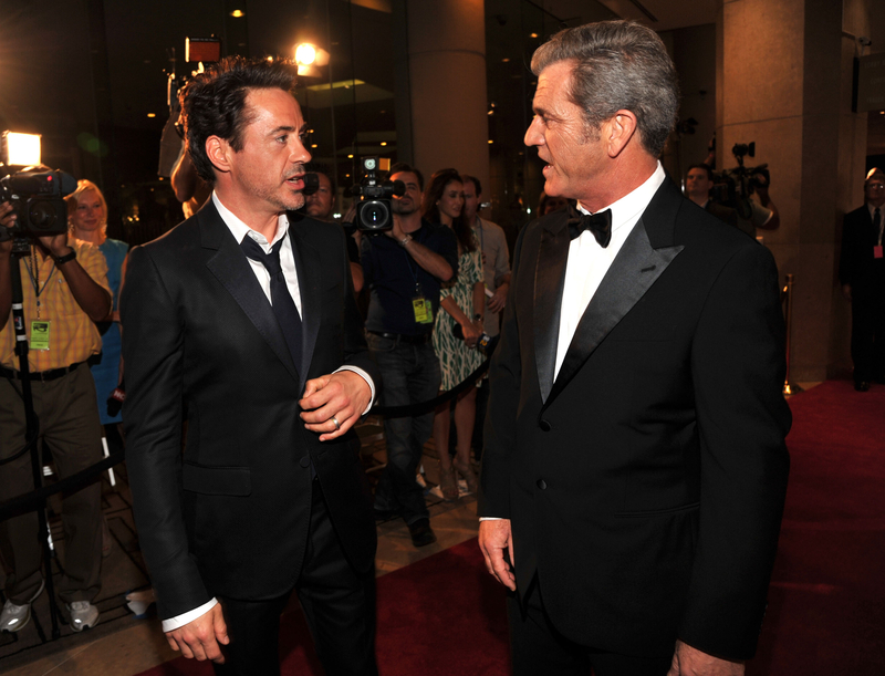 Mel Gibson & Robert Downey Jr. | Getty Images Photo by Lester Cohen/WireImage