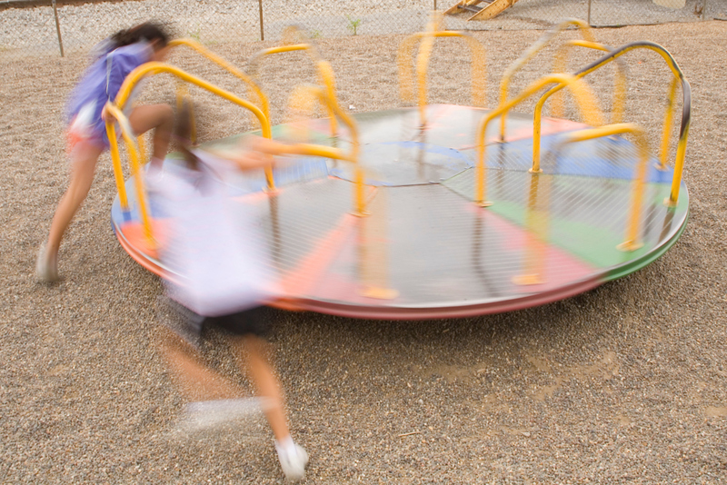 Spinning Your Kids Really Fast On The Merry-Go-Round | Alamy Stock Photo by Bill Grant
