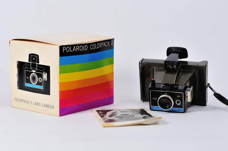 Profusely Shaking Polaroid Photos to Help Them Develop Faster | Alamy Stock Photo by Bradley Sauter 