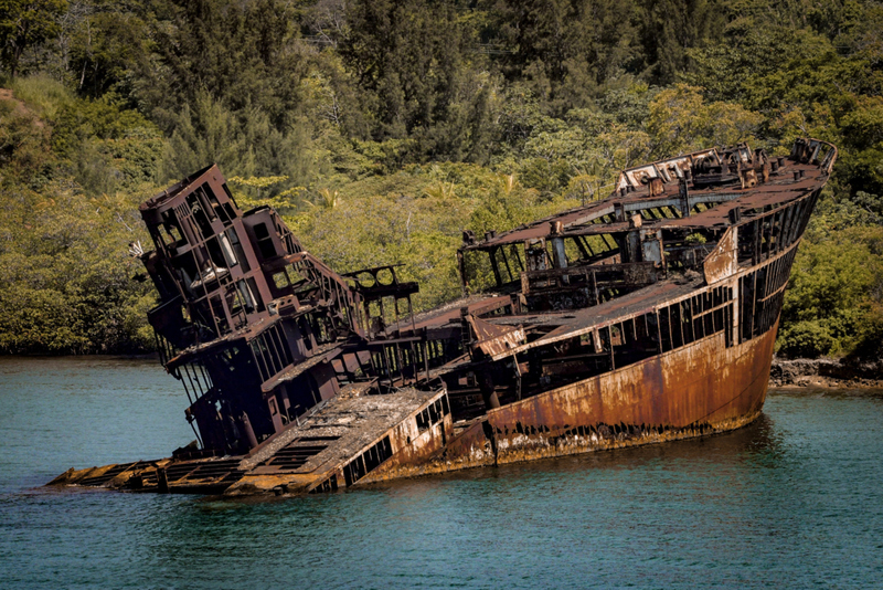 Partially Sunken Ship in Roatan, Honduras | Getty Images Photo by Moussa81
