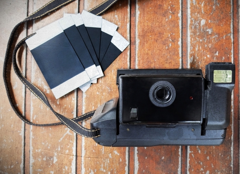 Take Pictures with Polaroid Cameras | SirichaiKeng/Shutterstock
